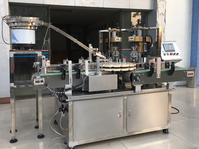 capping machine with 2 capping heads skrutkovacie zariadenie poloautomatické.jpg